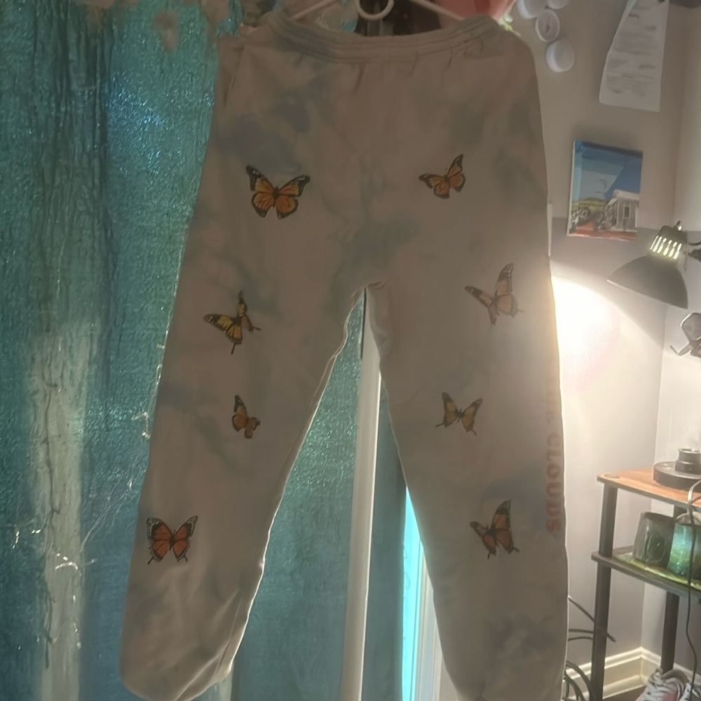 blue and white almost tie dye pattern pants with monarch butterflies